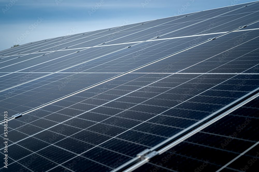 Sun energy with solar panels close up. View on blue sky Sun energy with solar panels close up. View on blue sky
