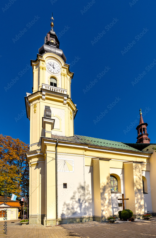 St. Matthias church, kosciol sw. Macieja, under autumn colors in historic old town quarter of Andrychow in Poland