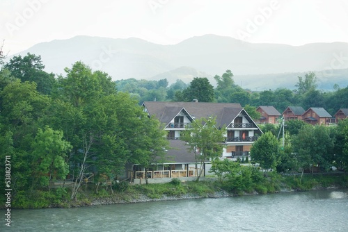 Hotel on the river bank in the mountains. Outdoor recreation.