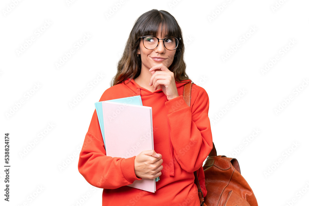 Young student caucasian woman over isolated background and looking up - obrazy, fototapety, plakaty 