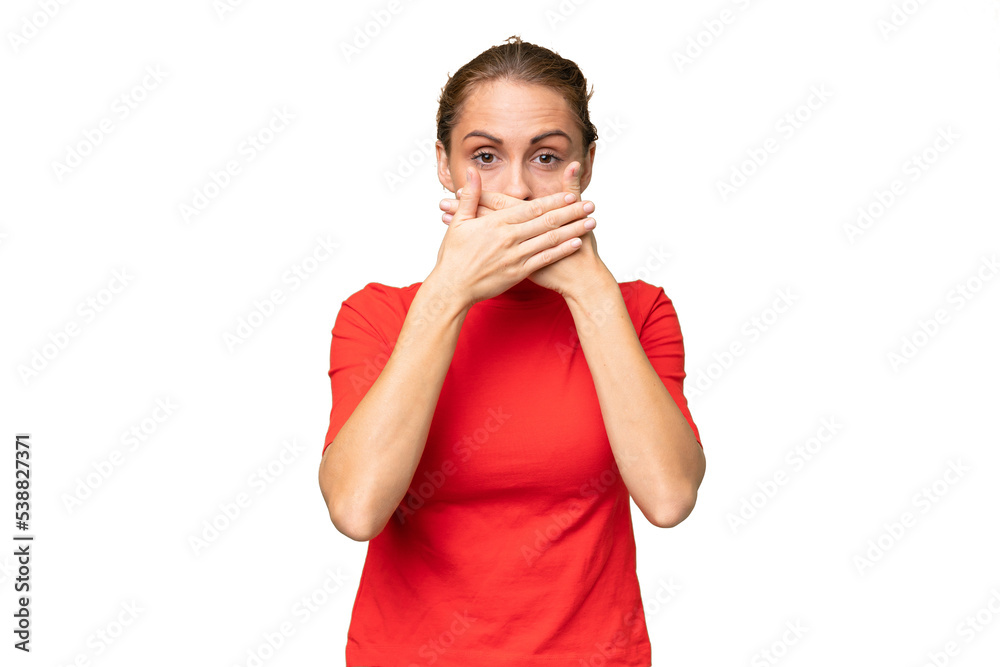 Young caucasian woman over isolated background covering mouth with hands Young caucasian woman over isolated background covering mouth with hands