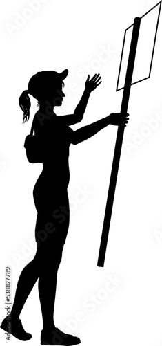 Protestor or demonstrator at a demonstration march, picket line or strike protest rally in silhouette. Holding up a banner or picket sign board placard.