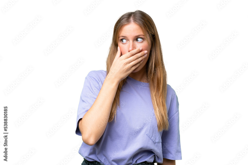 Young beautiful woman over isolated background doing surprise gesture while looking to the side Young beautiful woman over isolated background doing surprise gesture while looking to the side