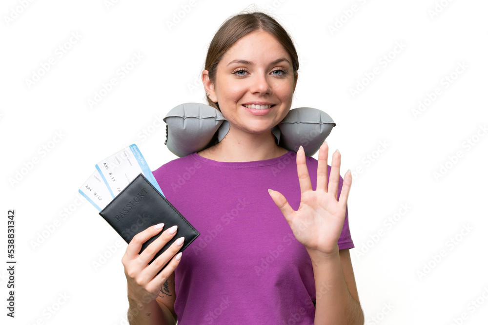 Young beautiful blonde woman with Inflatable travel Pillow over isolated background counting five with fingers Young beautiful blonde woman with Inflatable travel Pillow over isolated background counting five with fingers