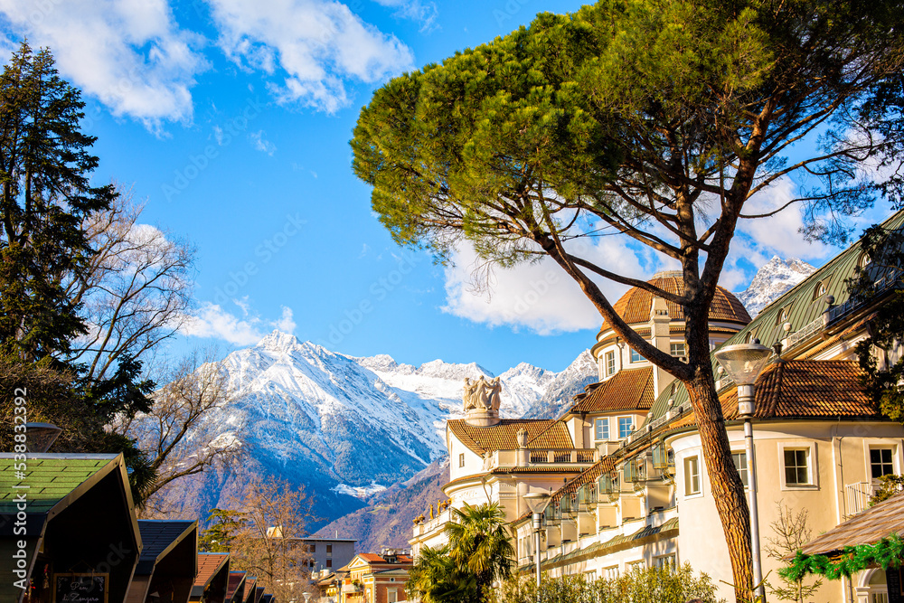 Merano o Meran is a city and comune in South Tyrol, northern Italy. Generally best known for its spa resorts. Alps mountains in winter time. - obrazy, fototapety, plakaty 