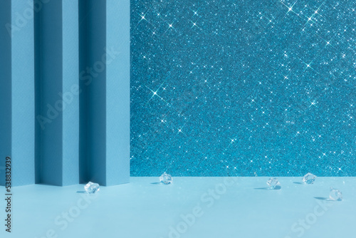 Abstract geometric blue and shiny sparkling background with crystals for the presentation of a cosmetic product or gift. Premium podium, scene. Showcase, display case.
