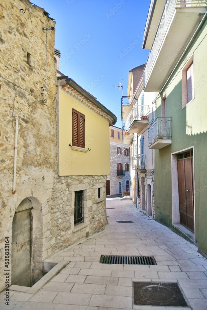 A narrow street between the old stone houses of Bagnoli del Trigno, a medieval village in the Molise region of Italy.