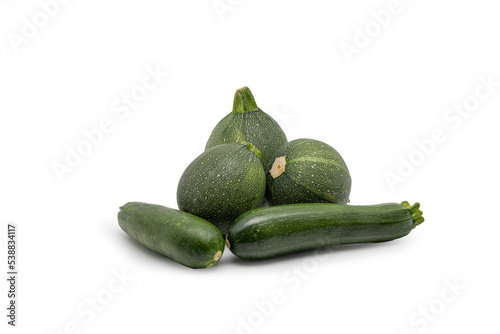 Runde und Lange Zucchinis auf weißem Hintergrund photo