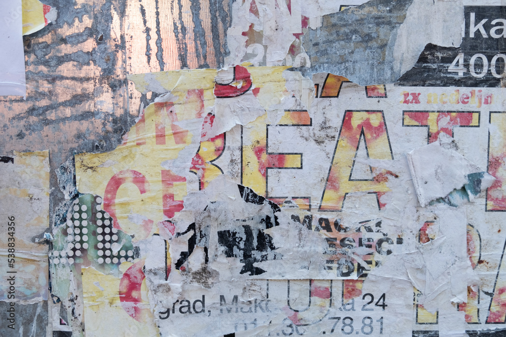 Fototapeta premium Torn street poster abstract background collage with ripped paper texture
