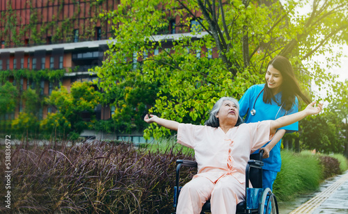 The joy of the joyful elderly patient is well taken care of by a beautiful female doctor to encourage him to recuperate his body and mind : Health insurance for the elderly concept.