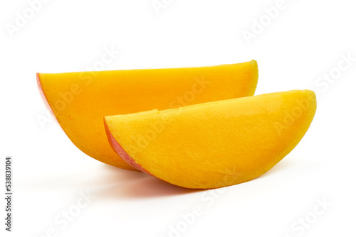 Juicy ripe Mango fruit slices, close-up, isolated on white background.