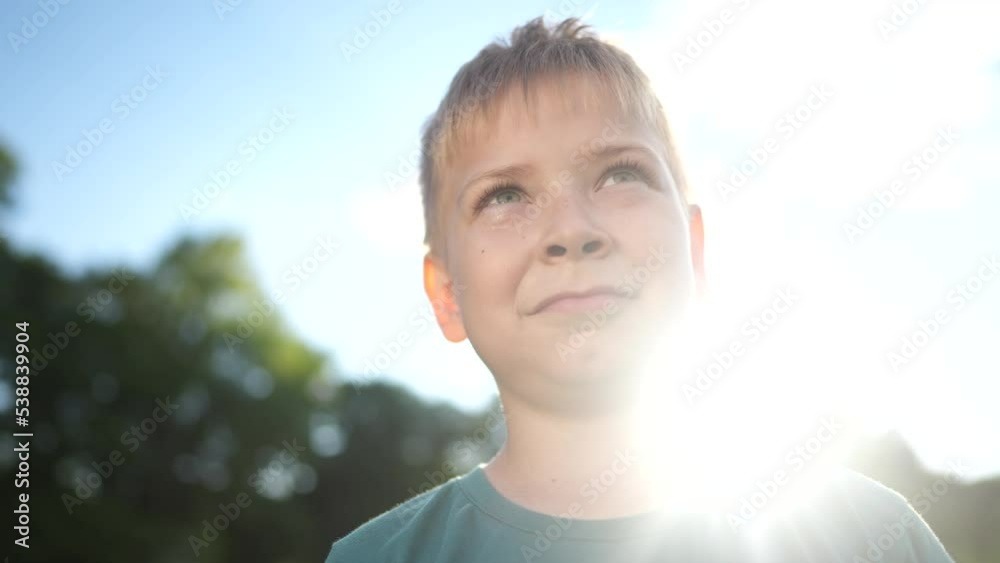 little boy portrait in the park. close-up a kid child in nature. happy family kid concept. happy sunlight girl close-up smiling. cheerful little boy portrait. child outdoors nature in the park little boy portrait in the park. close-up a kid child in nature. happy family kid concept. happy sunlight girl close-up smiling. cheerful little boy portrait. child outdoors nature in the park