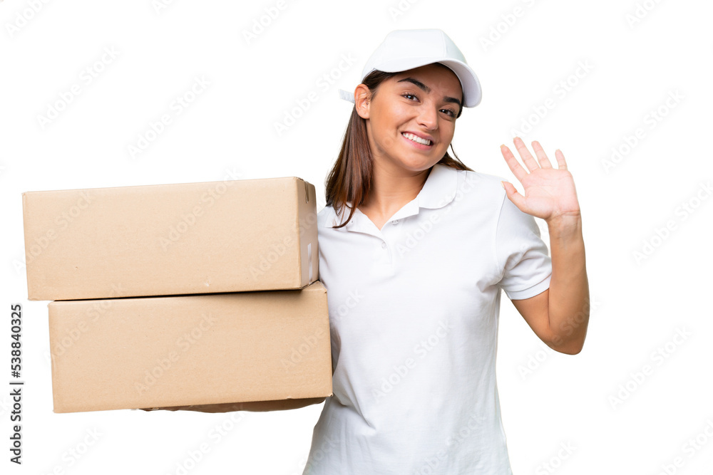 Delivery caucasian woman holding boxes isolated on green chroma background saluting with hand with happy expression Delivery caucasian woman holding boxes isolated on green chroma background saluting with hand with happy expression