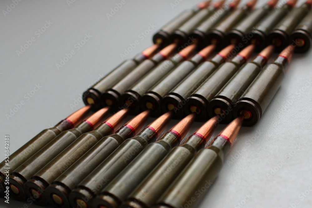 Live Ammunition For The Assault Rifle Is Laid Out In Rows Isolated Stock Photo Live Ammunition For The Assault Rifle Is Laid Out In Rows Isolated Stock Photo