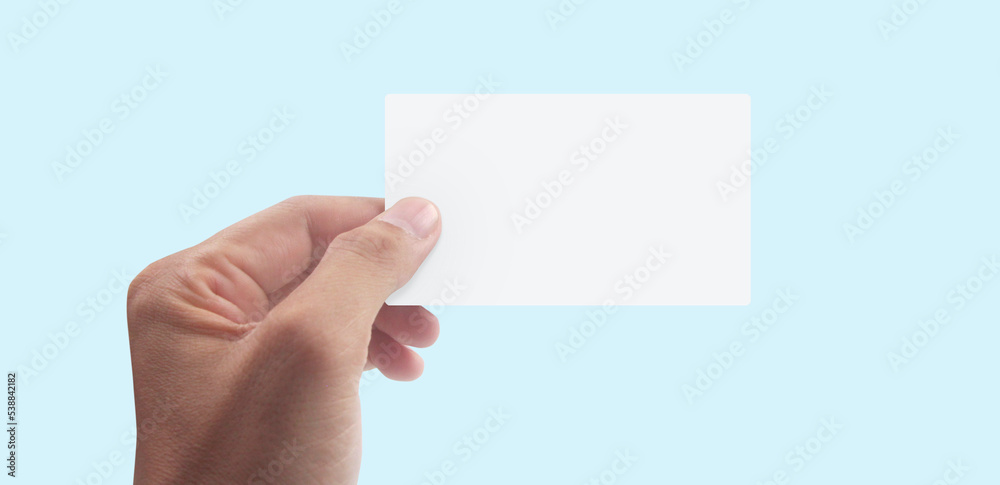 Close up of hand holding virtual card with. Credit card Close up of hand holding virtual card with. Credit card