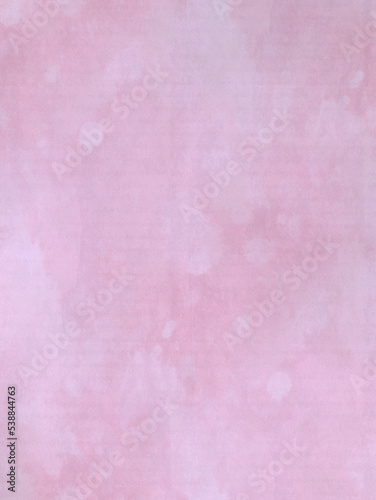Pink watercolor stains on the texture of the paper. Subtle background in a feminine style.