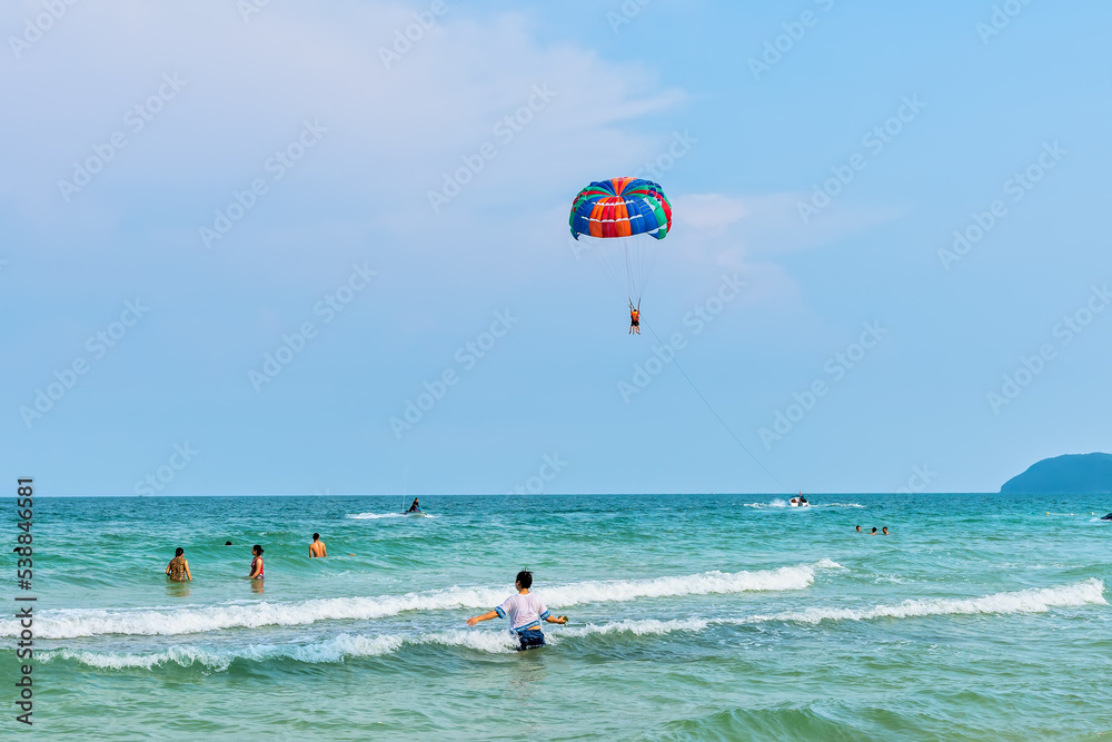 Beautiful tropical beach on the pearl island of Phu Quoc, Vietnam. The beach is clean, clear and blue, with fine sand stretching to attract tourists to have fun at the weekend Beautiful tropical beach on the pearl island of Phu Quoc, Vietnam. The beach is clean, clear and blue, with fine sand stretching to attract tourists to have fun at the weekend