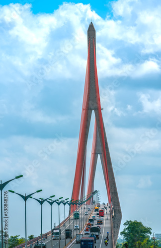 Can Tho, Vietnam - April 21st, 2022: Heavy traffic on Can Tho bridge on summer afternoon . Can Tho bridge is famous bridge in mekong delta, Vietnam. photo