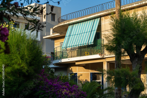 Striped sun protection on a balcony in the old town of Rhodes