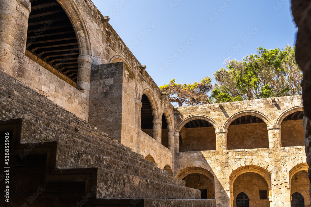 Stone building with arches in the ancient city of Rhodes in Greece