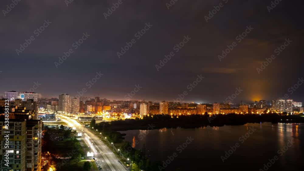Thunderstorm over the night city,road with moving cars along the river,timelapse Thunderstorm over the night city,road with moving cars along the river,timelapse