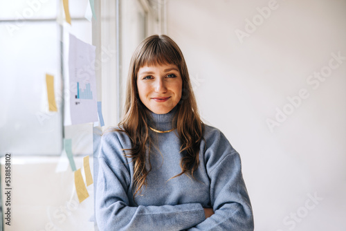 Portrait of a young businesswoman looking at the camera in an office photo