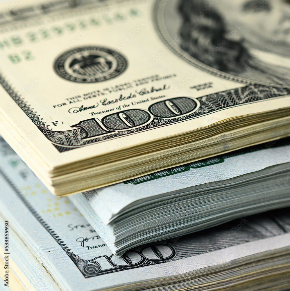 Bundles of hundred dollar bills background closeup Bundles of hundred dollar bills background closeup