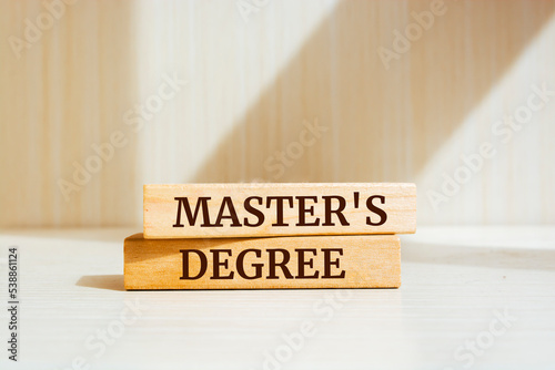 Wooden blocks with words 'Master's Degree'.