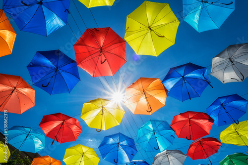 Street decorated with colored umbrellas close up