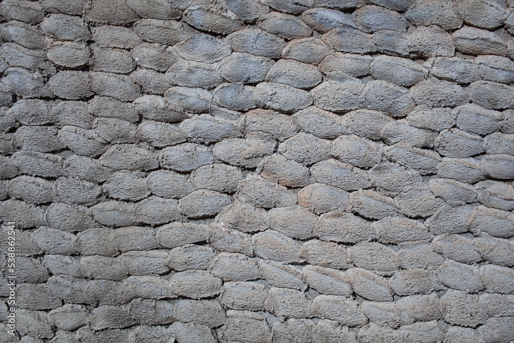 Old stone wall texture background. Rough stone wall. Big rough stones fence Old stone wall texture background. Rough stone wall. Big rough stones fence