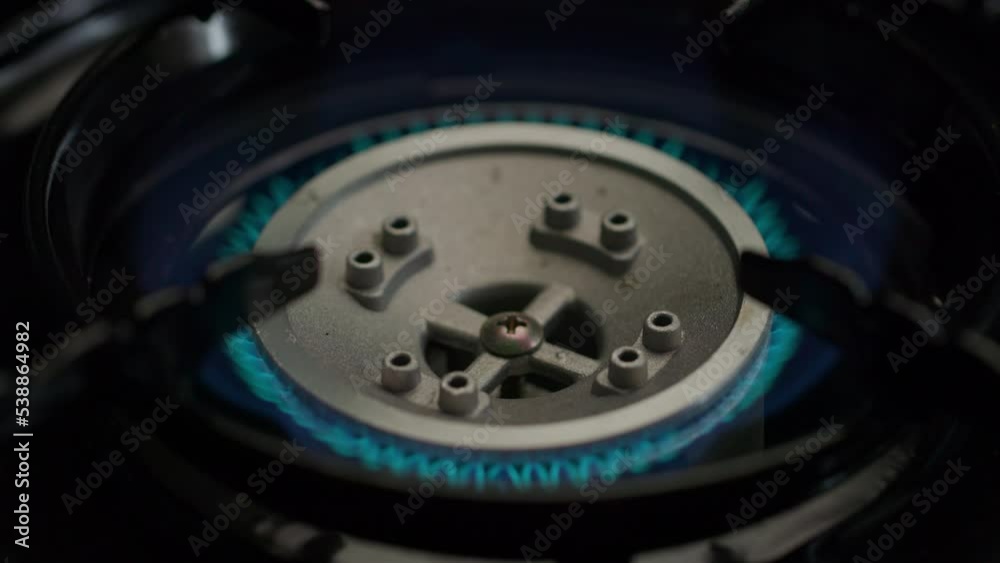 Gas stove burning with blue flames in slow motion. Gas stove burning with blue flames in slow motion.