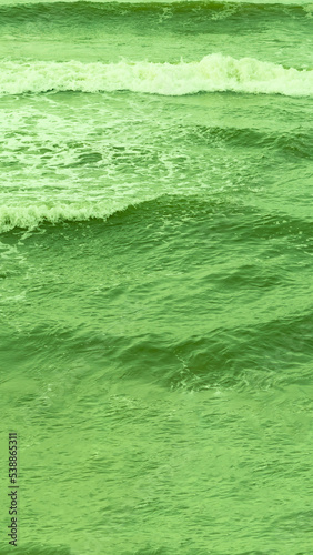 Real photo sea water waves, abstract background, nature power, bright green more tone in stock