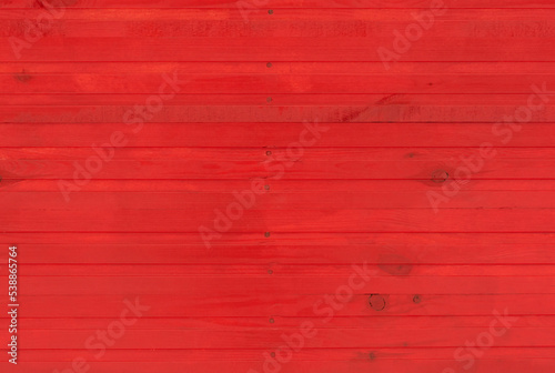 red wooden wall made of planks