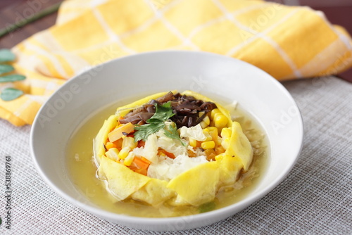 Sop Matahari is a dish from Surakarta, Central Java. This soup made from mushroom, chicken chop, carrot, corn,celery and then wrapped by fried egg added chicken stock and fried onion.