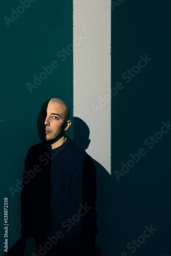 Man sitting in ray of light