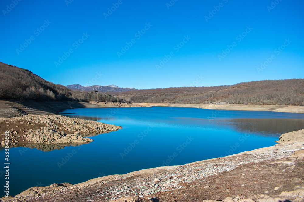 mountain lake with water and blue sky