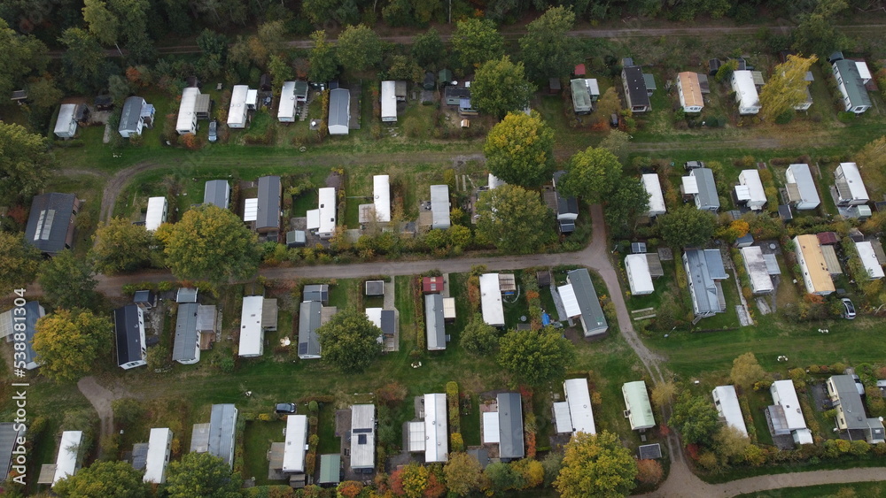 Aerial view of campsite with mobile home caravans near a forest in The Netherlands