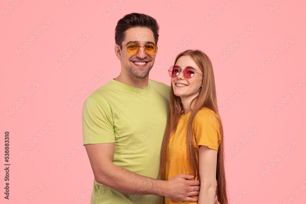 Stylish happy couple hugging each other Stylish happy couple hugging each other