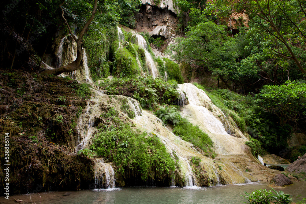 Fototapeta premium Erawan Waterfall in Kanchanaburi. Amazing turquoise water and wonderful jungle. Ideal place for a picnic and relaxation. One of the most famous tourist attractions in Kanchanaburi province, Thailand. 