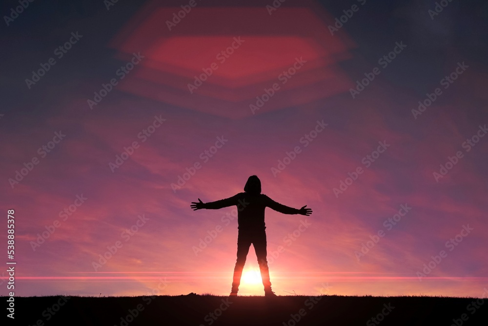 Fototapeta premium man trekking in the mountain with a sunset background in summertime