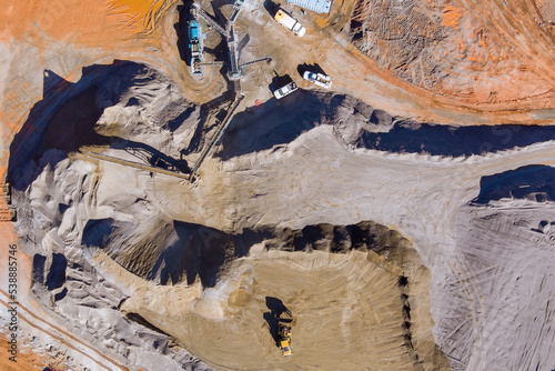 This is panoramic view stone crushing equipment along mechanical conveyor belt that is used stone to make gravel for road construction