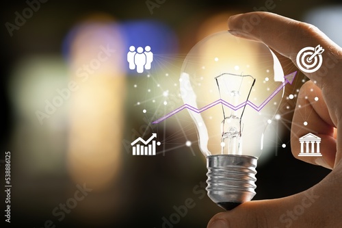 Businessman hand holding light bulb for ideas concept