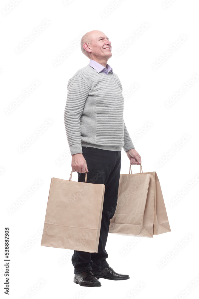 in full growth. happy man with shopping bags. in full growth. happy man with shopping bags.