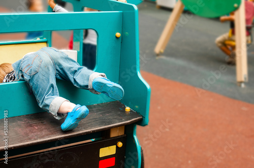 Photos Child playing on a colorful playground