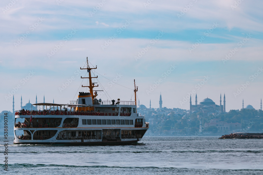 Travel to Istanbul background photo. Ferry and Hagia Sophia on background