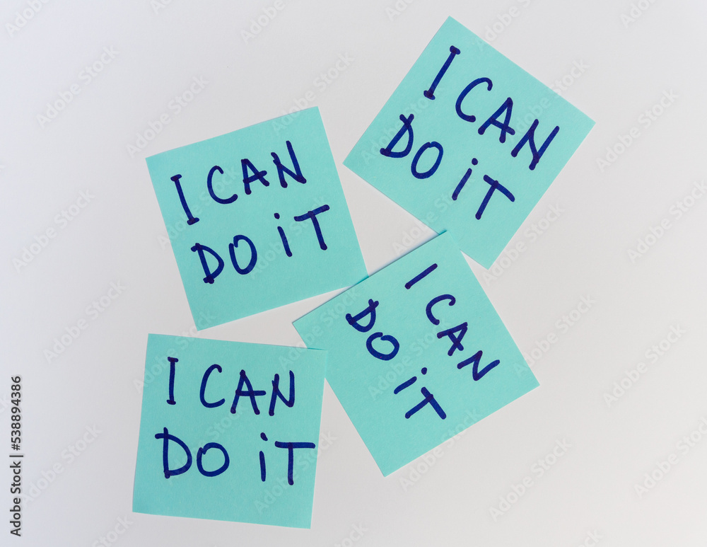 I can do it quote, phrase written on a sticky notes over white board I can do it quote, phrase written on a sticky notes over white board