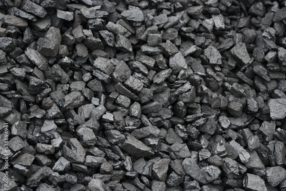 The texture of pieces of coal lying on top of each other. The texture of pieces of coal lying on top of each other.