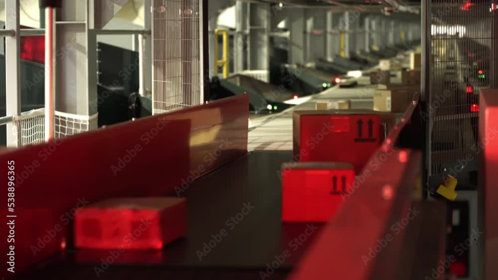 Kyiv, Ukraine - February 2021.
Automated, sorting line of conveyor sorting of parcels. A company that provides express delivery of goods and parcels for individuals and businesses. Logistics center.