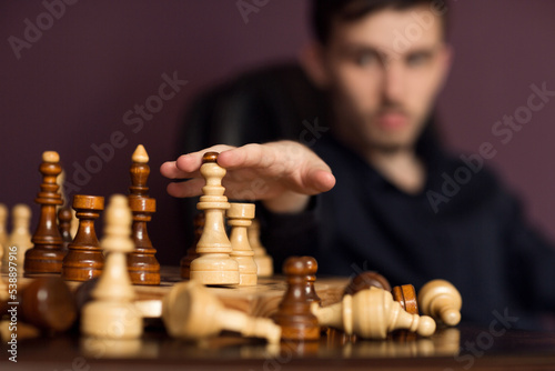 chess pieces and chess player's hand 