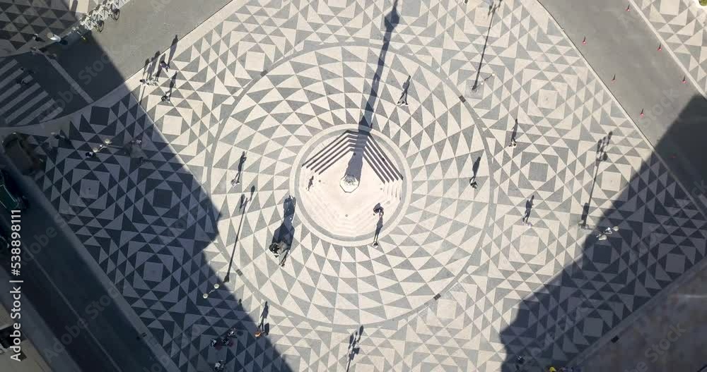 Aerial orbit top down View of municipio do comércio with some tourist visiting Lisbon, Portugal. amazing  Traditional Portuguese pavement.